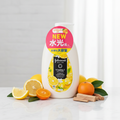 Johnson's Vitamin C Lotion editorial product shot with lemon citrus fruits and cedarwood on marble