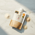 Rice Wash Off Pack editorial product shot with rice grains and golden light on marble